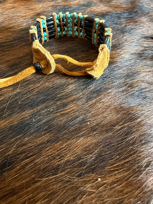 Leather tie fastener on Southwest by Design black hairpipe bracelet