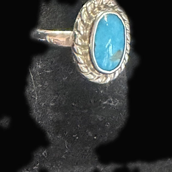 Genuine Turquoise Oval Ring — bright sky-blue oval touched with a single golden-brown patch at its edge