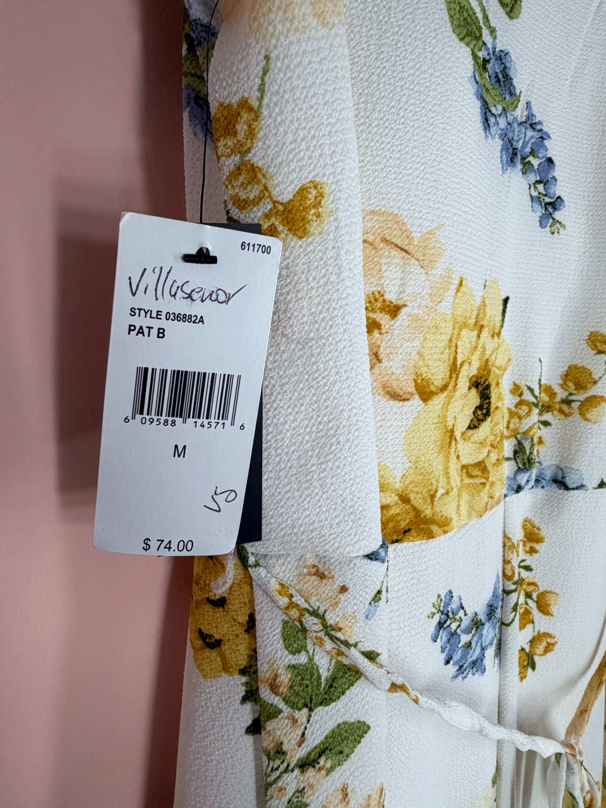 ALYX retail tag close-up showing original retail price of 74 dollars, size M