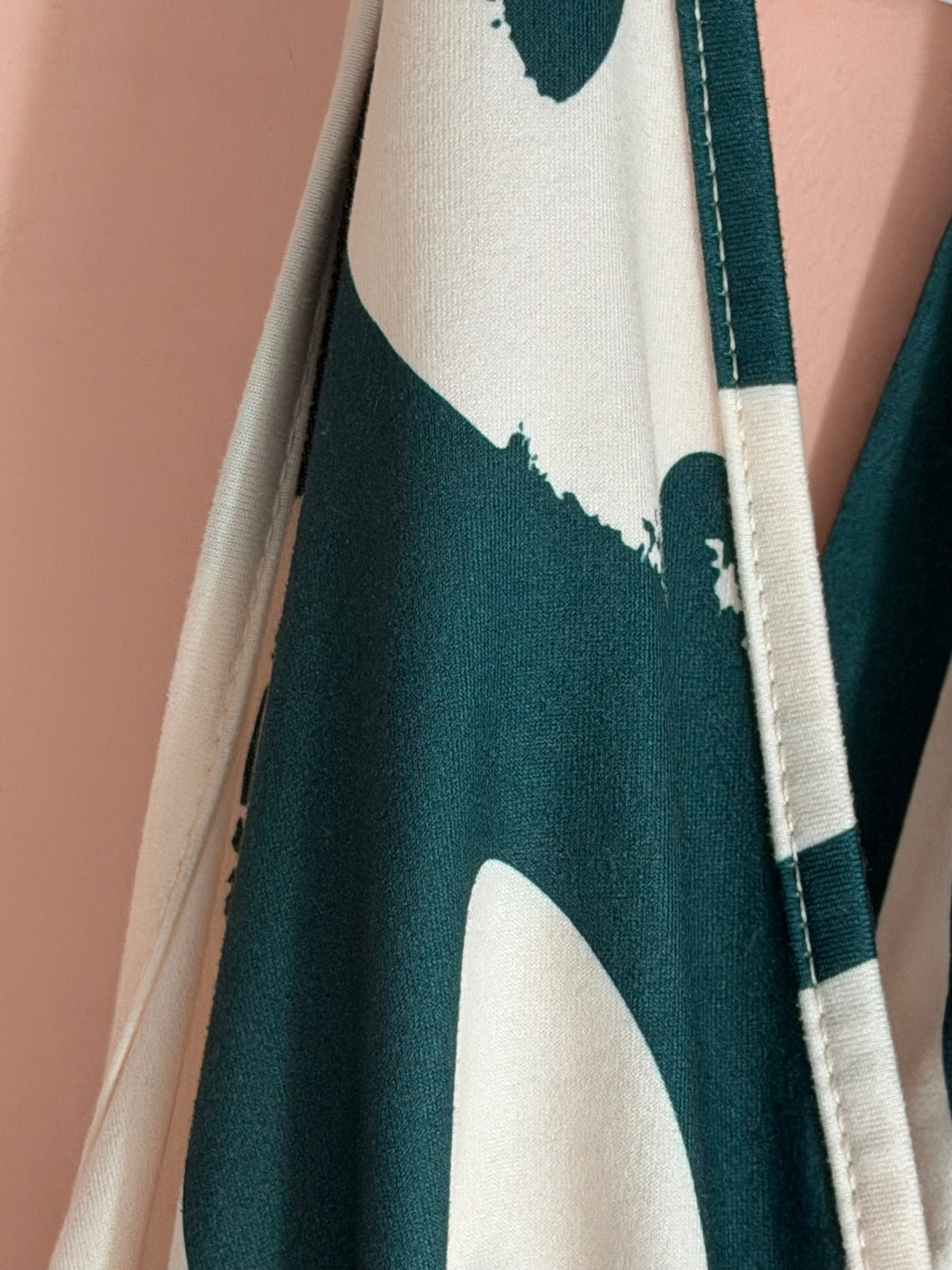 Cream abstract brushstroke halter maxi dress, fabric and print close-up