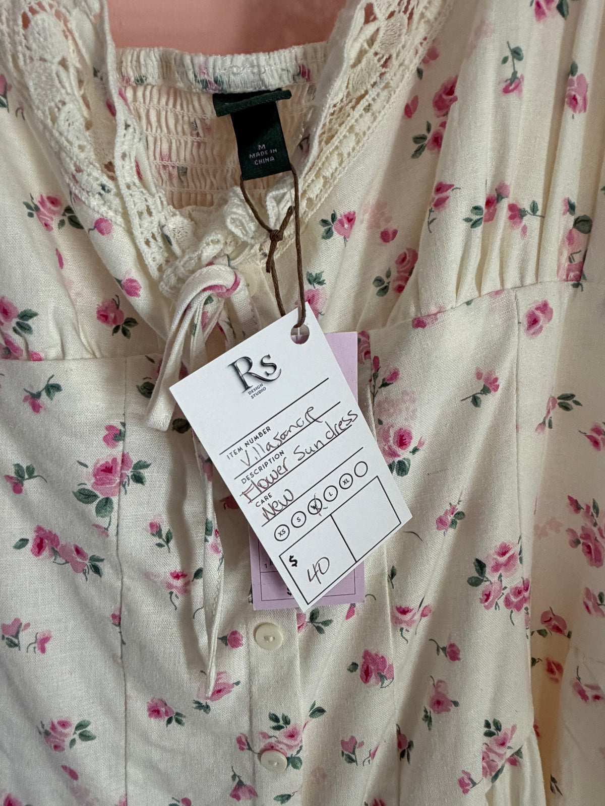 Ivory rose floral sundress label and price tag close-up, size M