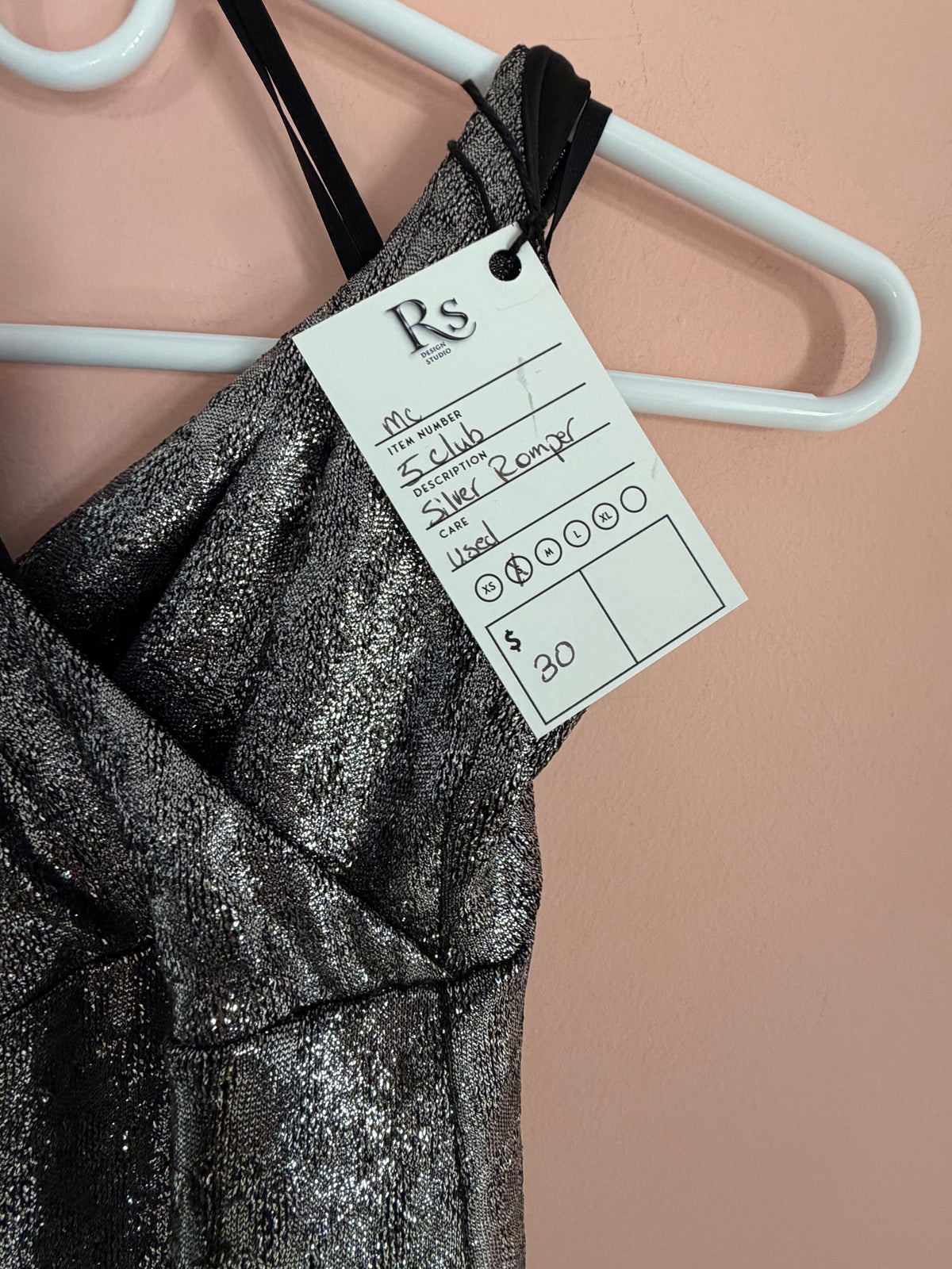 Silver metallic jumpsuit Regul Design Studio price tag close-up, size S