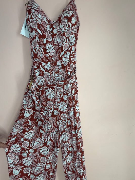 Rust and white floral wide-leg jumpsuit, front view