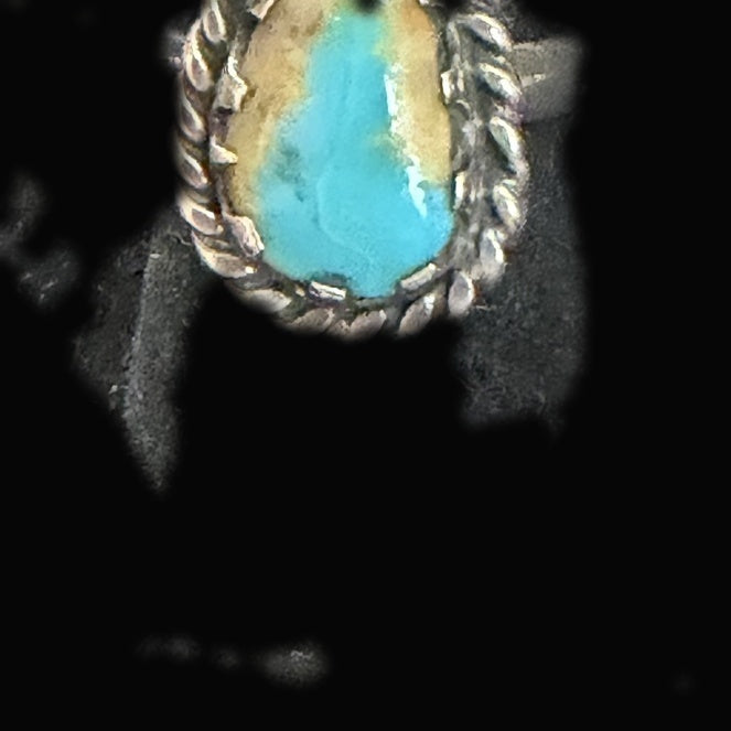 Genuine Turquoise Oval Ring — oval where dense golden-brown matrix claims half the stone and bright blue holds the other