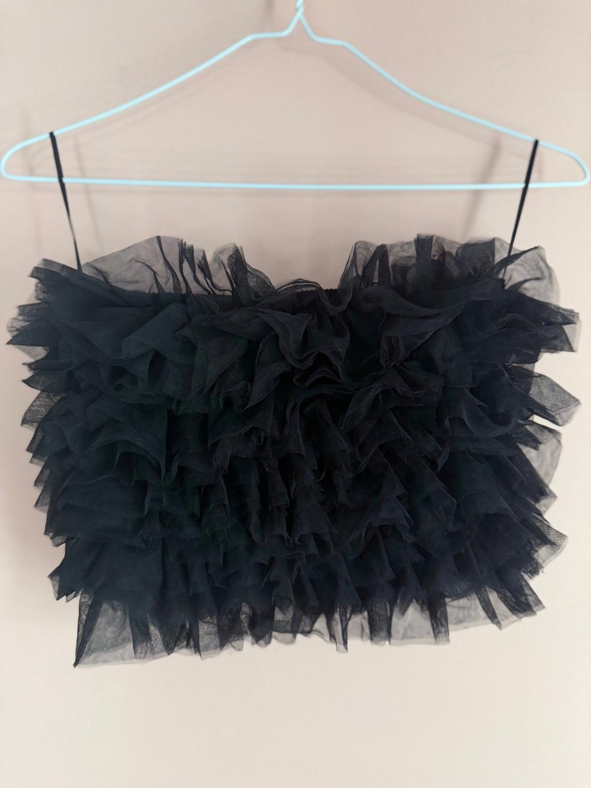 Miou Mu black tulle ruffle spaghetti strap crop top on hanger, alternate front view