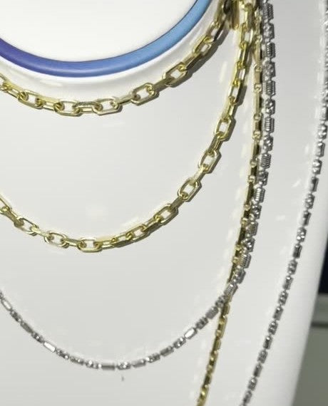 DESMOS barrel link chain necklace in rhodium-plated sterling silver, photographed in the DESMOS case at Regul Silver