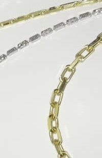 DESMOS paperclip necklace in 18k gold-plated sterling silver, photographed in the DESMOS case at Regul Silver