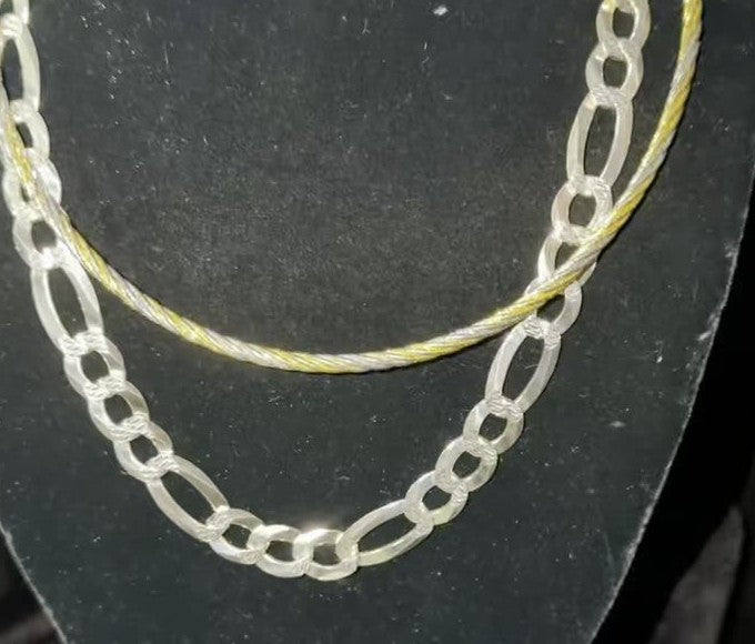 DESMOS figaro chain necklace — wide textured links in rhodium-plated sterling silver, photographed in the DESMOS case at Regul Silver
