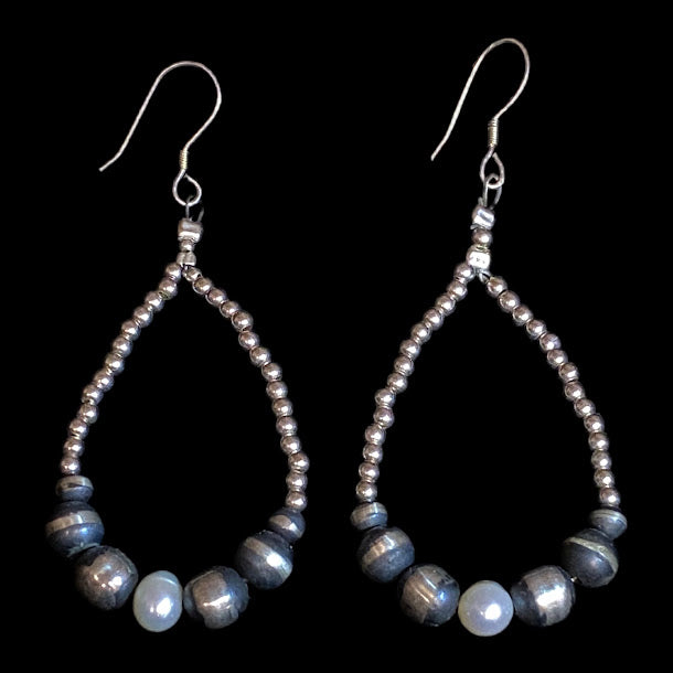 Navajo pearl earrings with baroque pearls - the pair straight on, white baroque pearl at the base of each teardrop