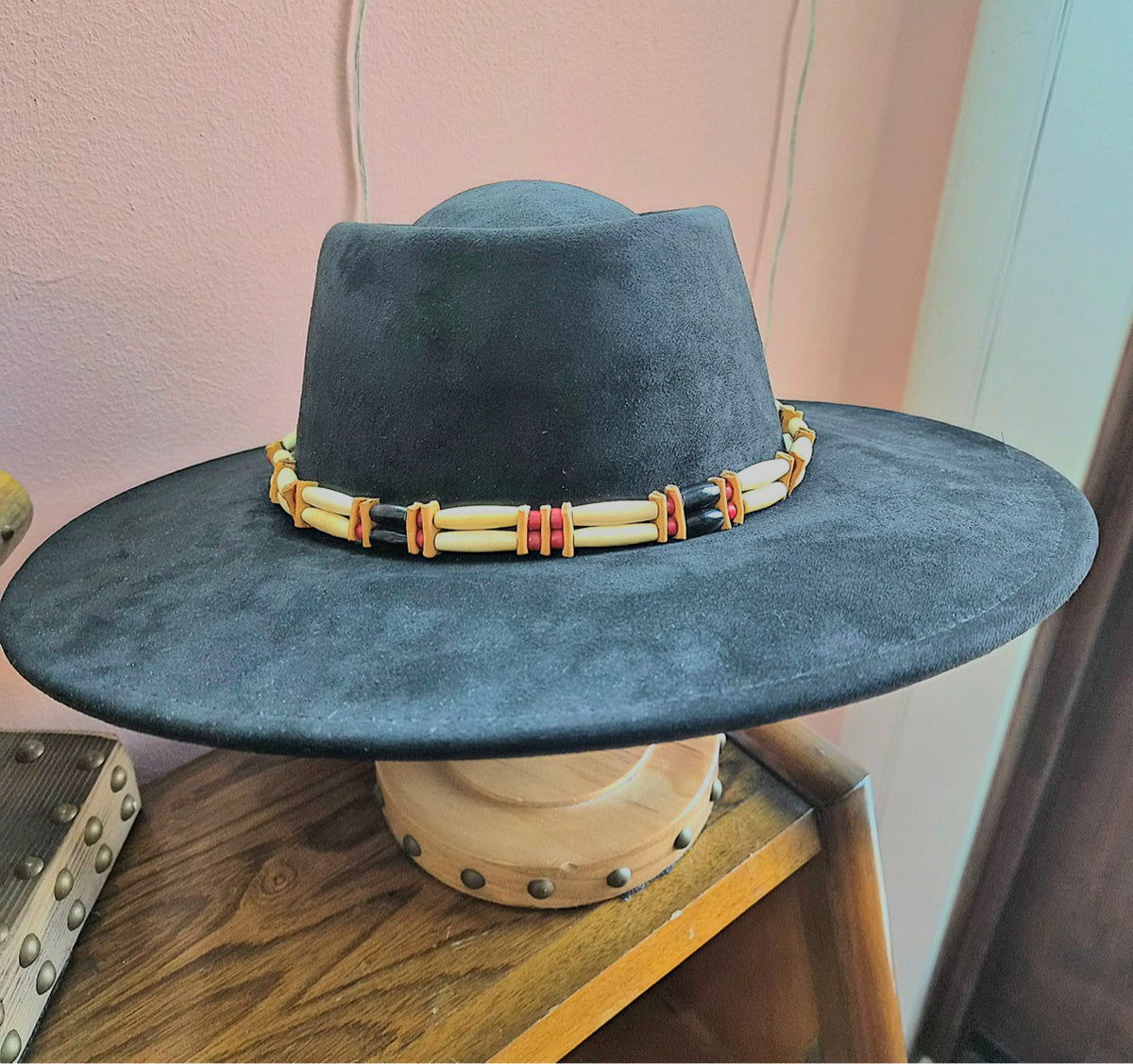 Bone hairpipe hat band by Southwest by Design shown on a black hat