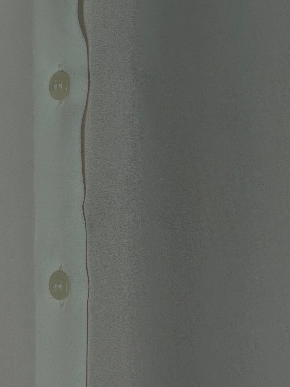 Button front detail on the H&M white sheer blouse