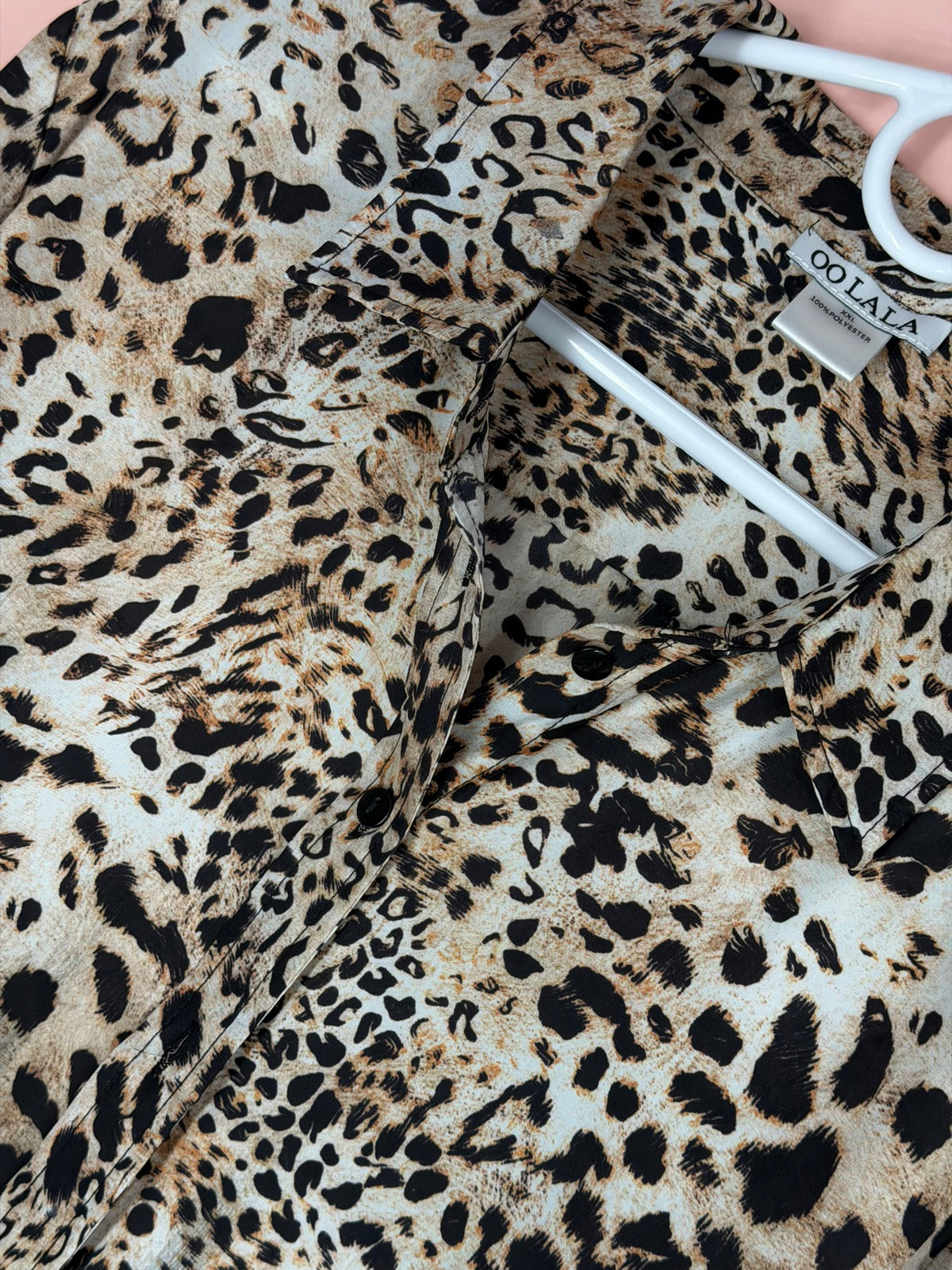Button placket and collar detail on the OO LALA leopard blouse