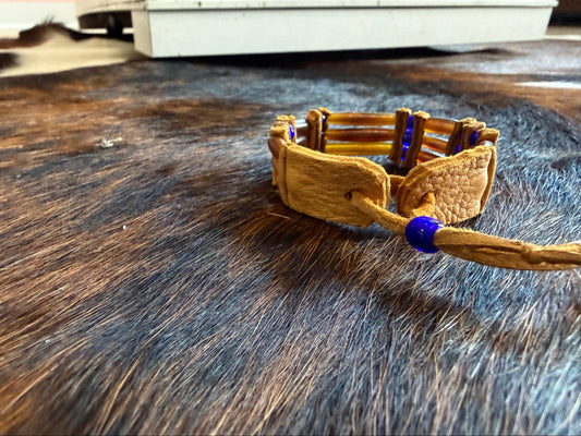 Leather tie fastener on Southwest by Design amber bone hairpipe bracelet