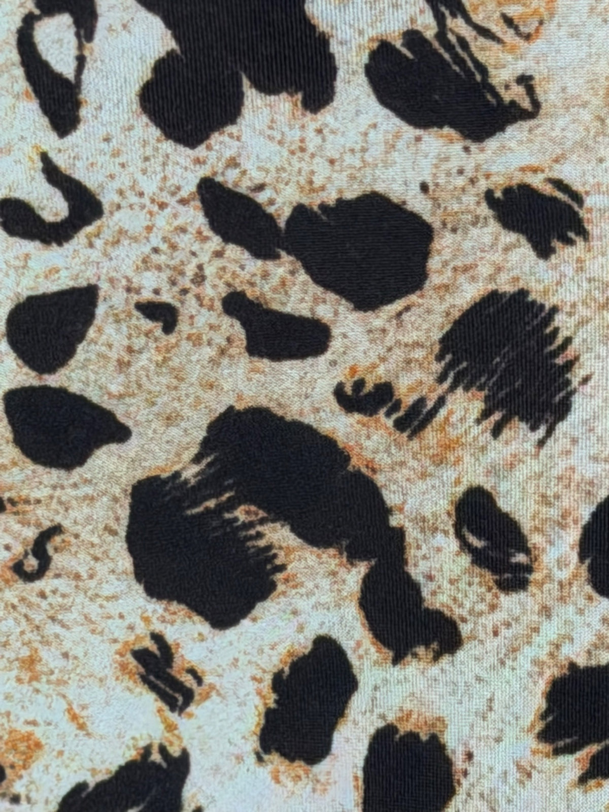 Leopard print fabric close-up on the OO LALA blouse