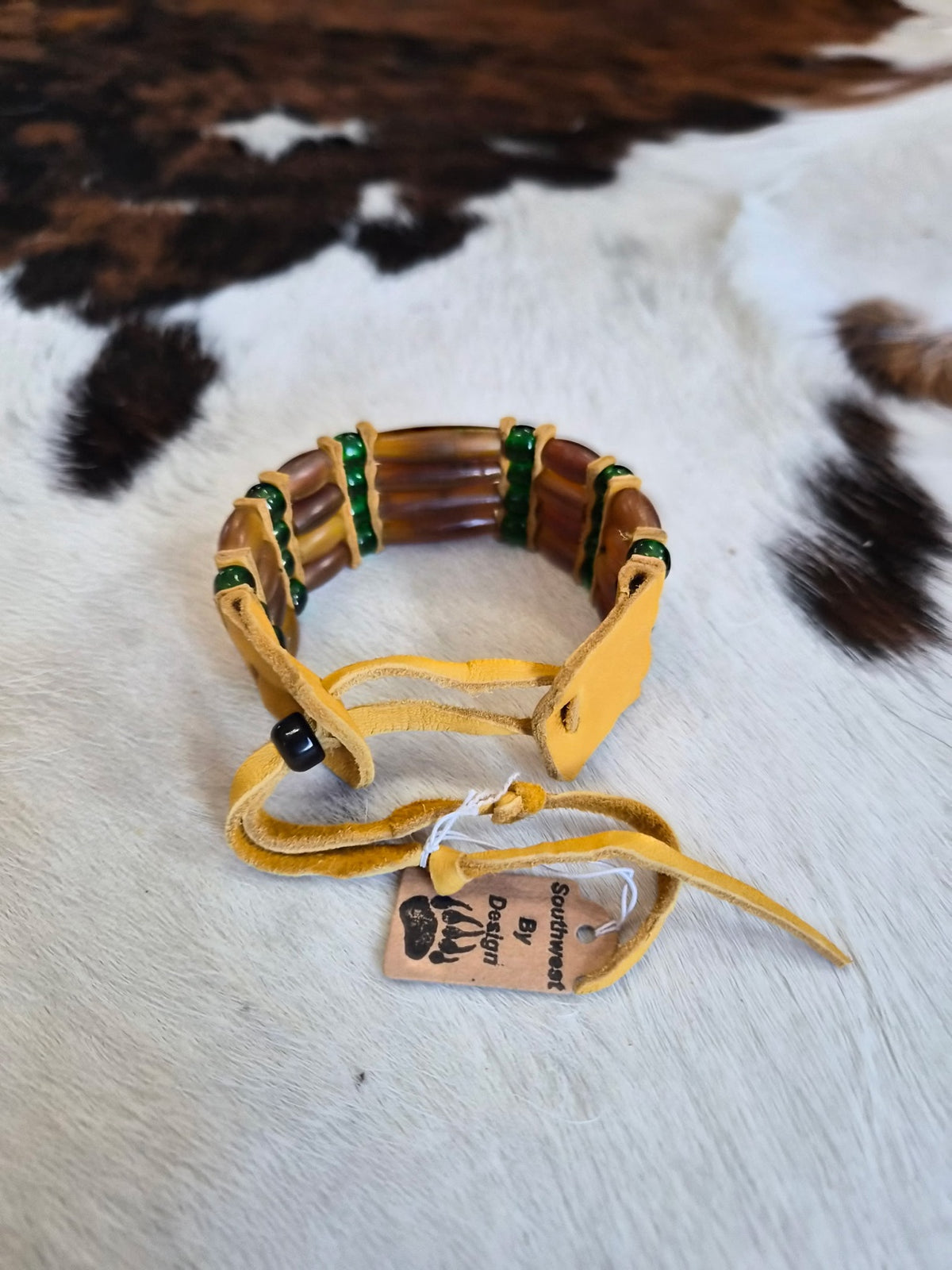 Leather tie fastener on Southwest by Design brown bone hairpipe bracelet