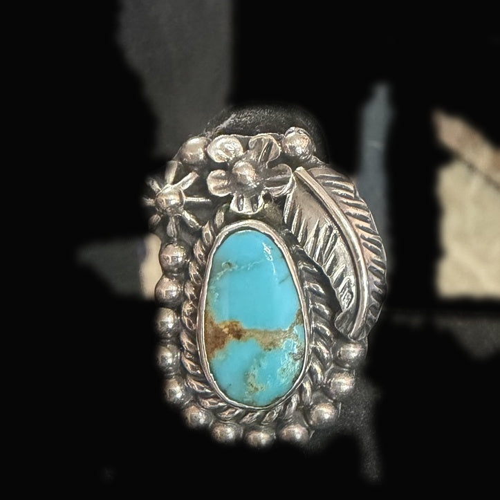 Genuine Turquoise Oval Ring — bright sky-blue oval banded with a rust-brown matrix stripe