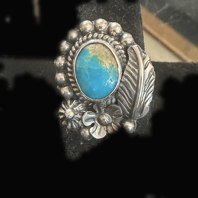 Genuine Turquoise Oval Ring — bright blue oval crowned with a golden-brown matrix cap