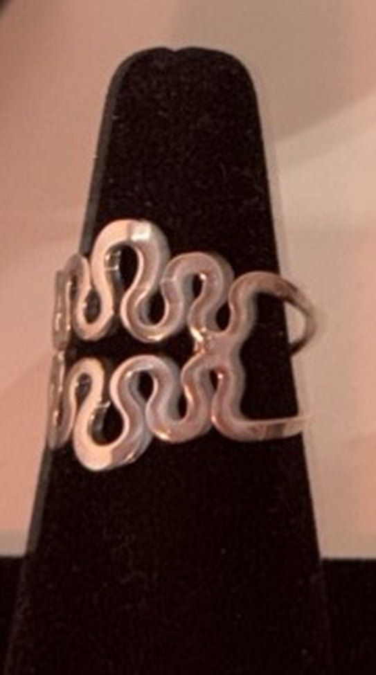 Sterling silver squiggle openwork band ring with two rows of waves on a black display cone, size 8