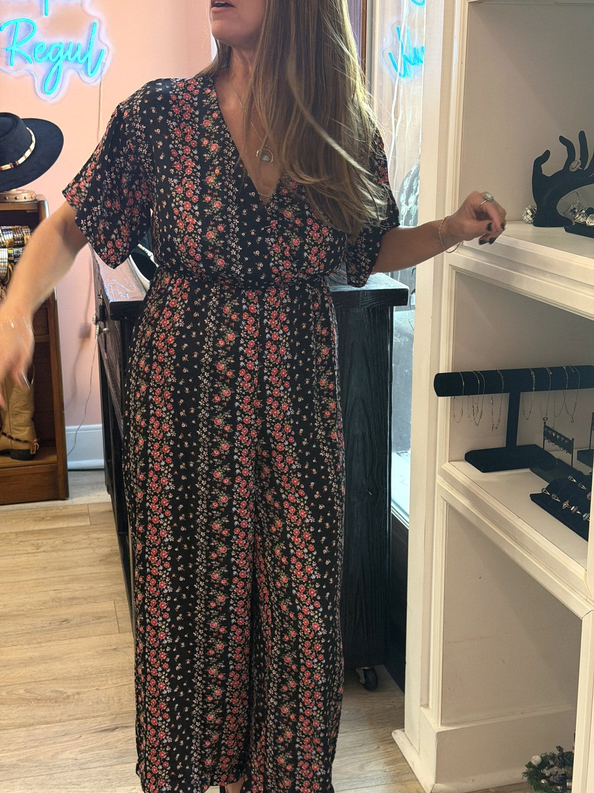 Model view of black Floral Wrap Wide-Leg Jumpsuit, Size M