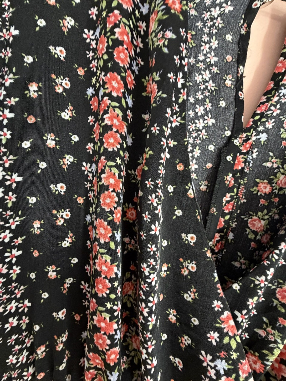 Black ditsy floral wrap jumpsuit fabric close-up