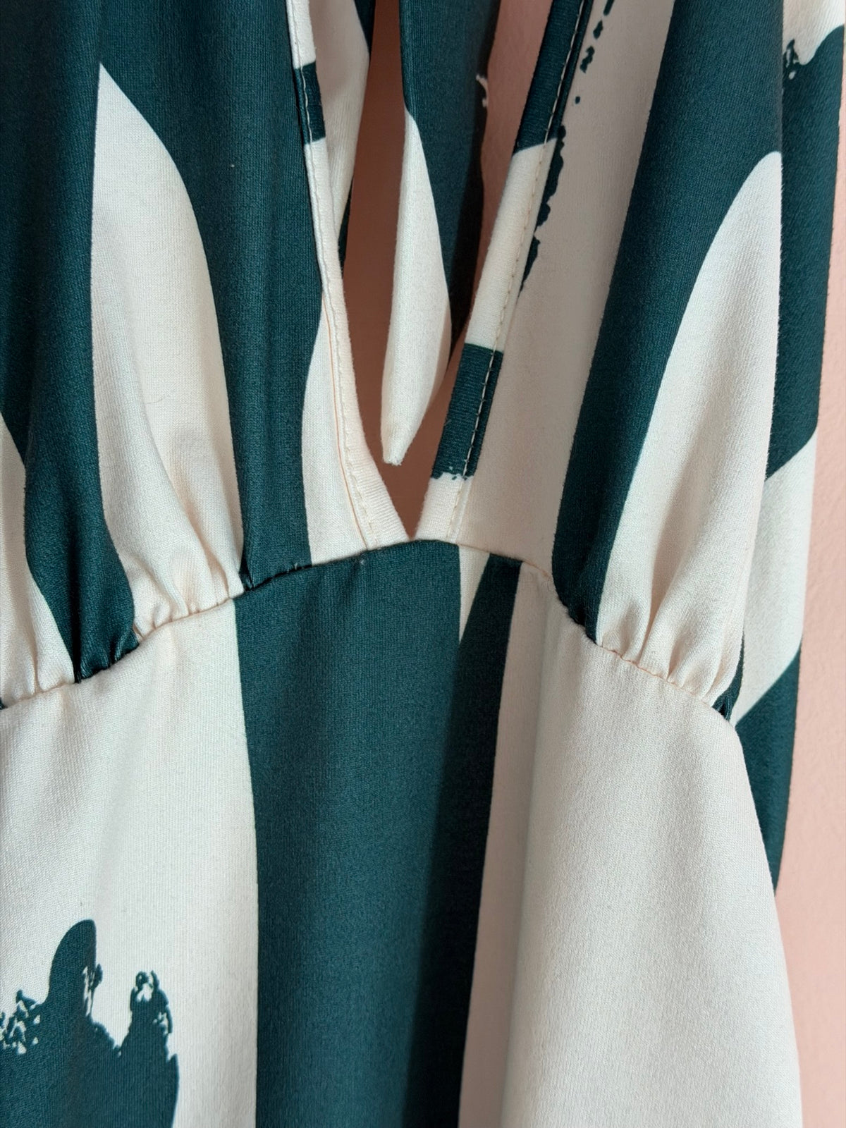 Cream abstract brushstroke halter maxi dress, bust and gathered empire waist close-up