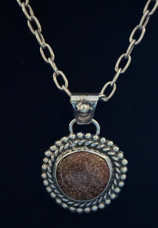 Front view of sparkling Goldstone Pendant|Handcrafted Western Silver Jewelry