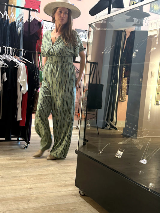 Sage green dotted print V-neck pantsuit worn in store at Regul Design Studio