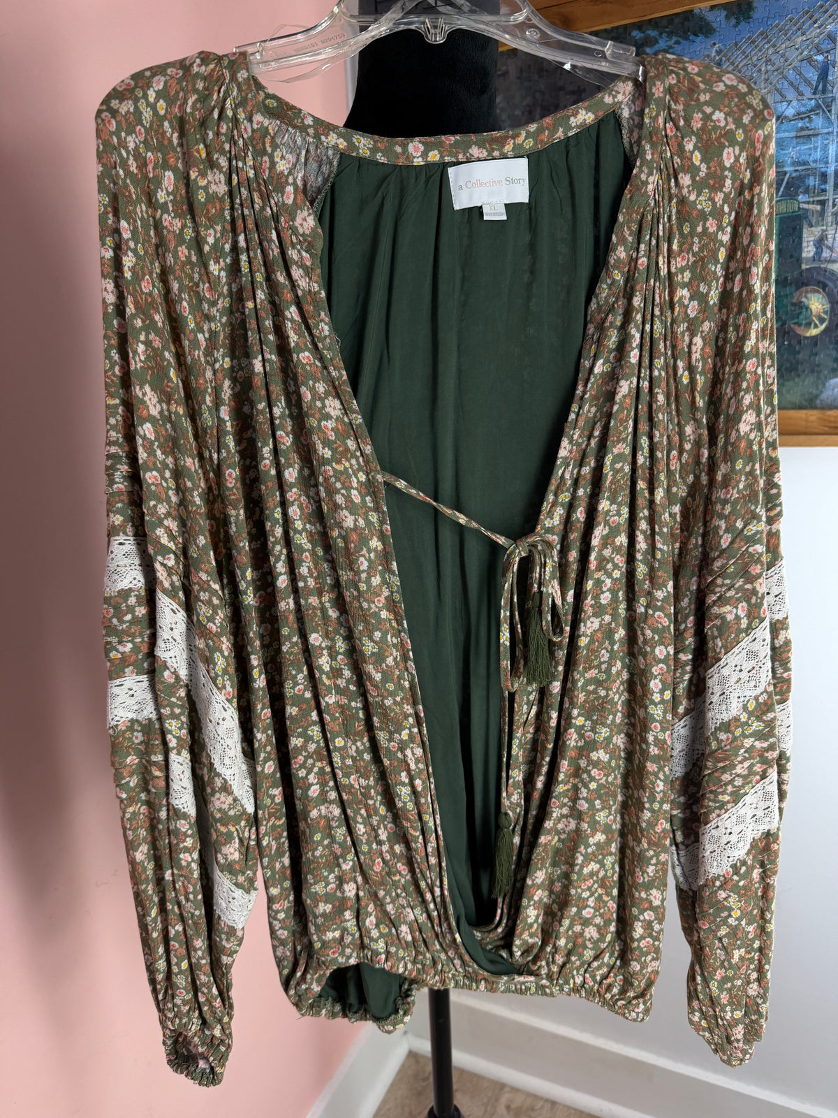 francesca's olive floral surplice wrap top with crochet lace sleeve trim over a green camisole, front view