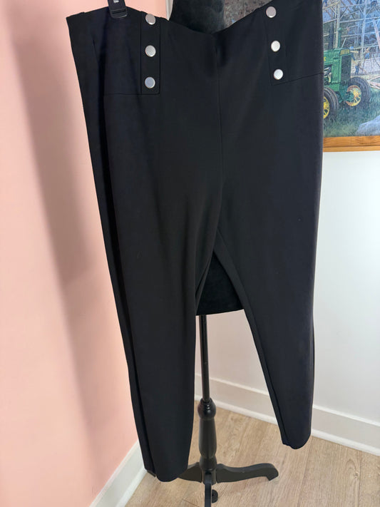 Forever 21+ black pants with silver sailor buttons at both hips, front view