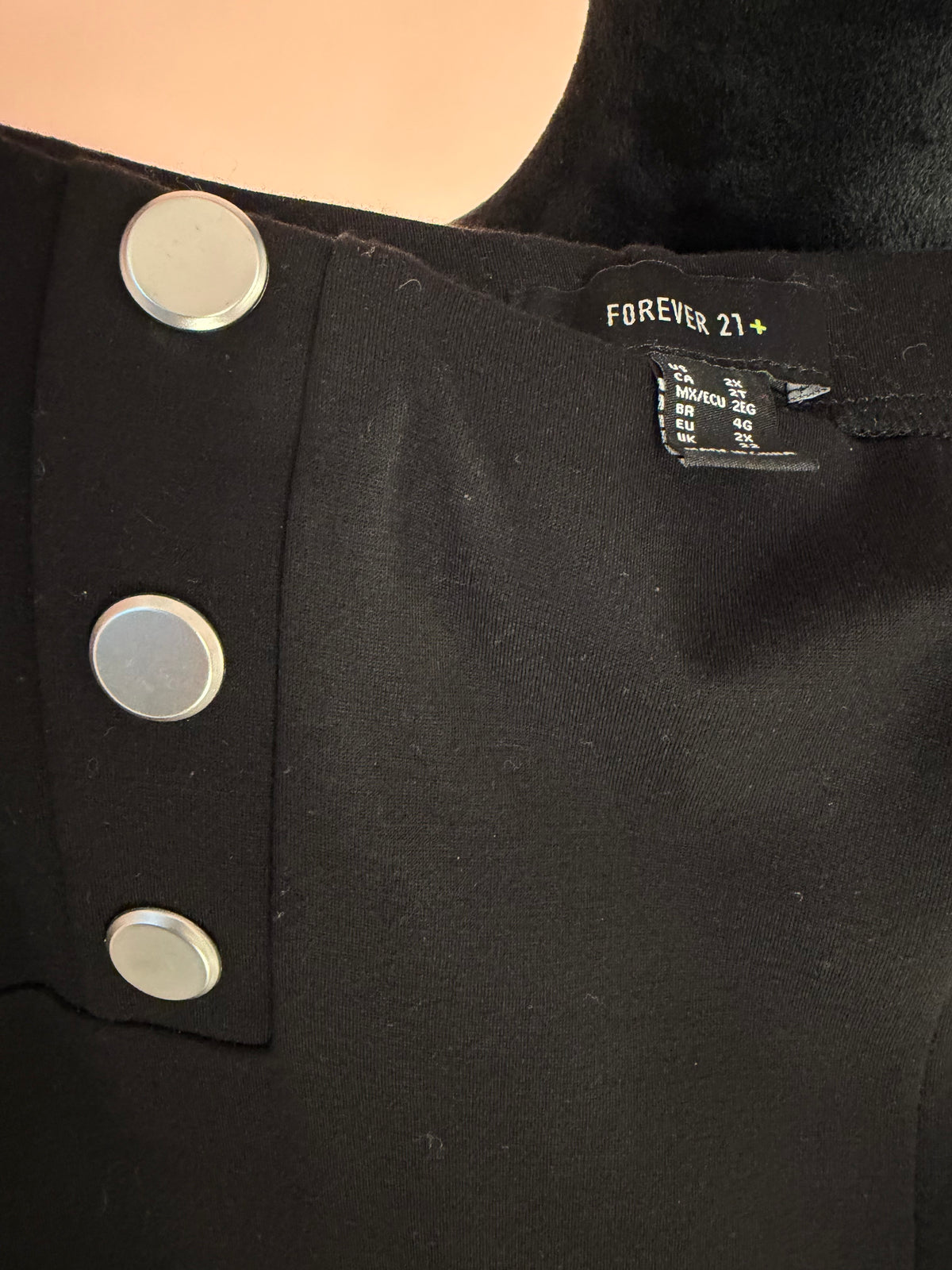 Forever 21+ label and silver sailor button close-up, size 2X