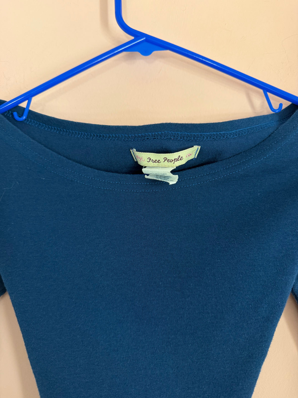 Free People brand label close-up at the neckline