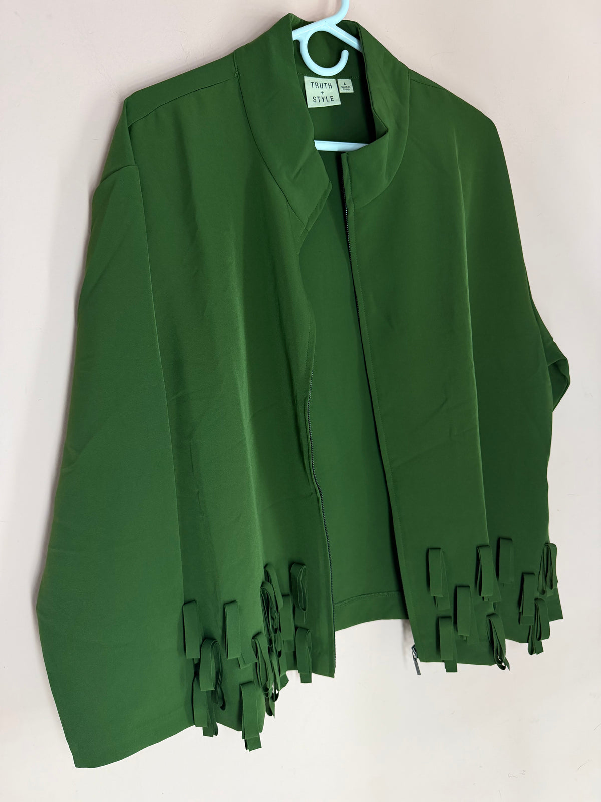 Truth + Style olive green open jacket with geometric fringe hem, front view