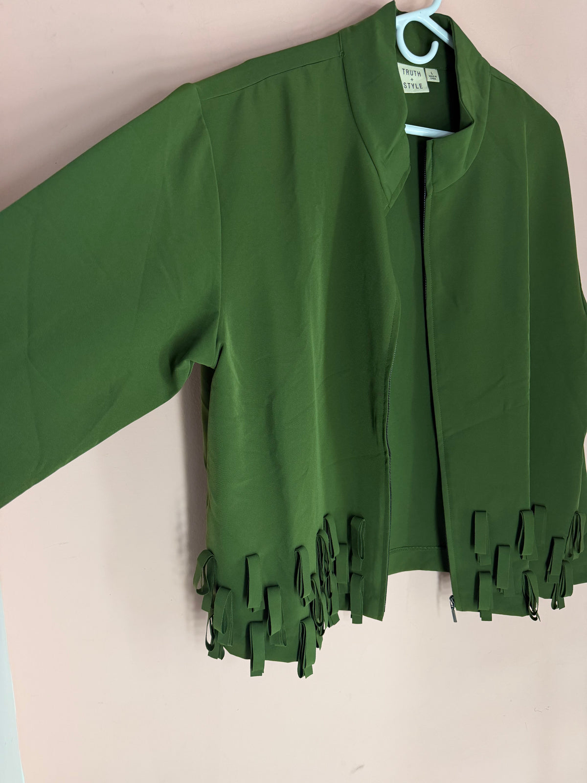 Truth + Style olive fringe jacket, three-quarter front angle