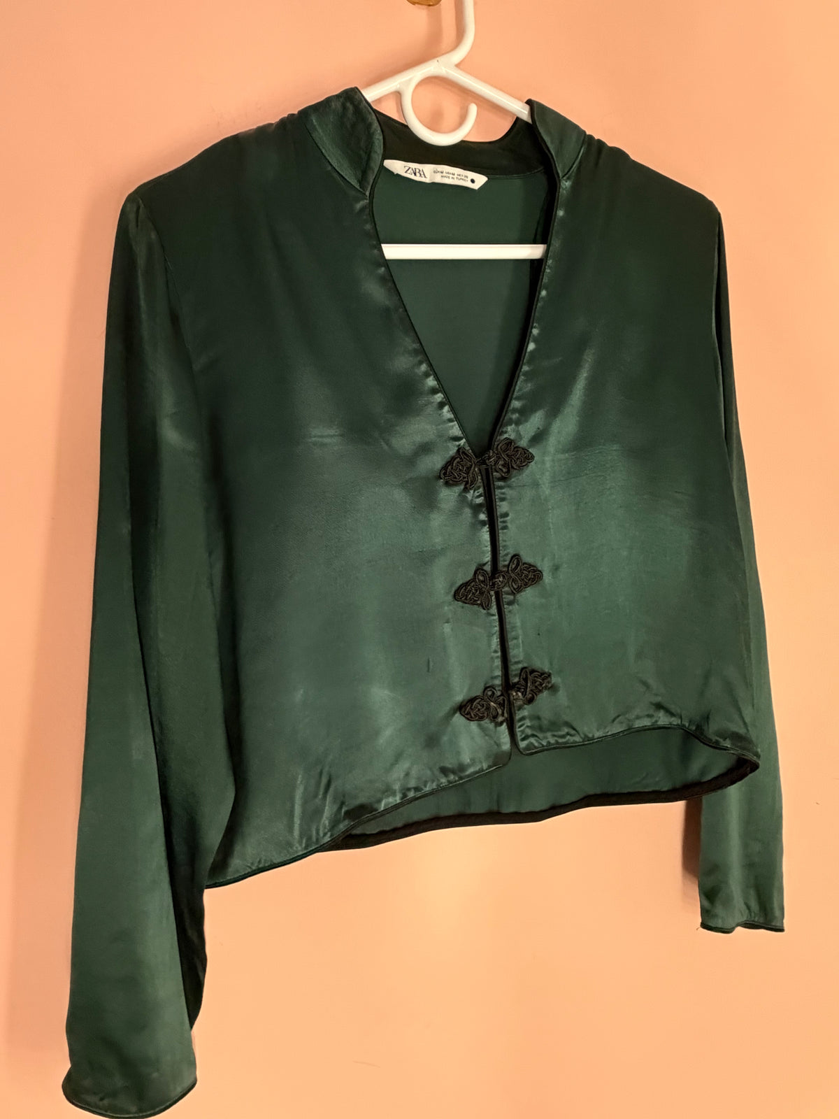 Zara dark emerald satin cropped jacket with black frog closures, front view