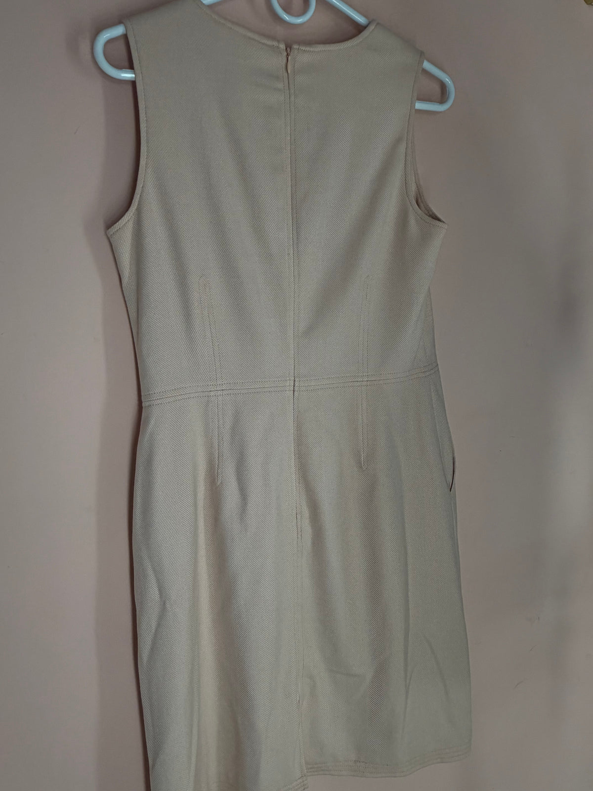 Banana Republic beige sleeveless sheath dress, back view with exposed zipper
