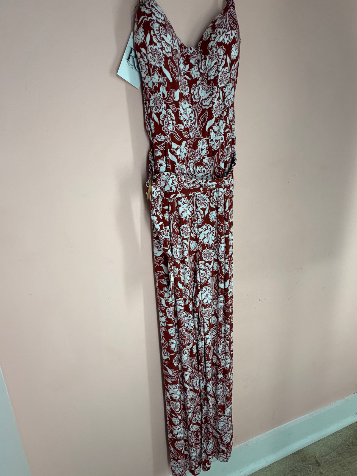 Rust and white floral wide-leg jumpsuit, full front view