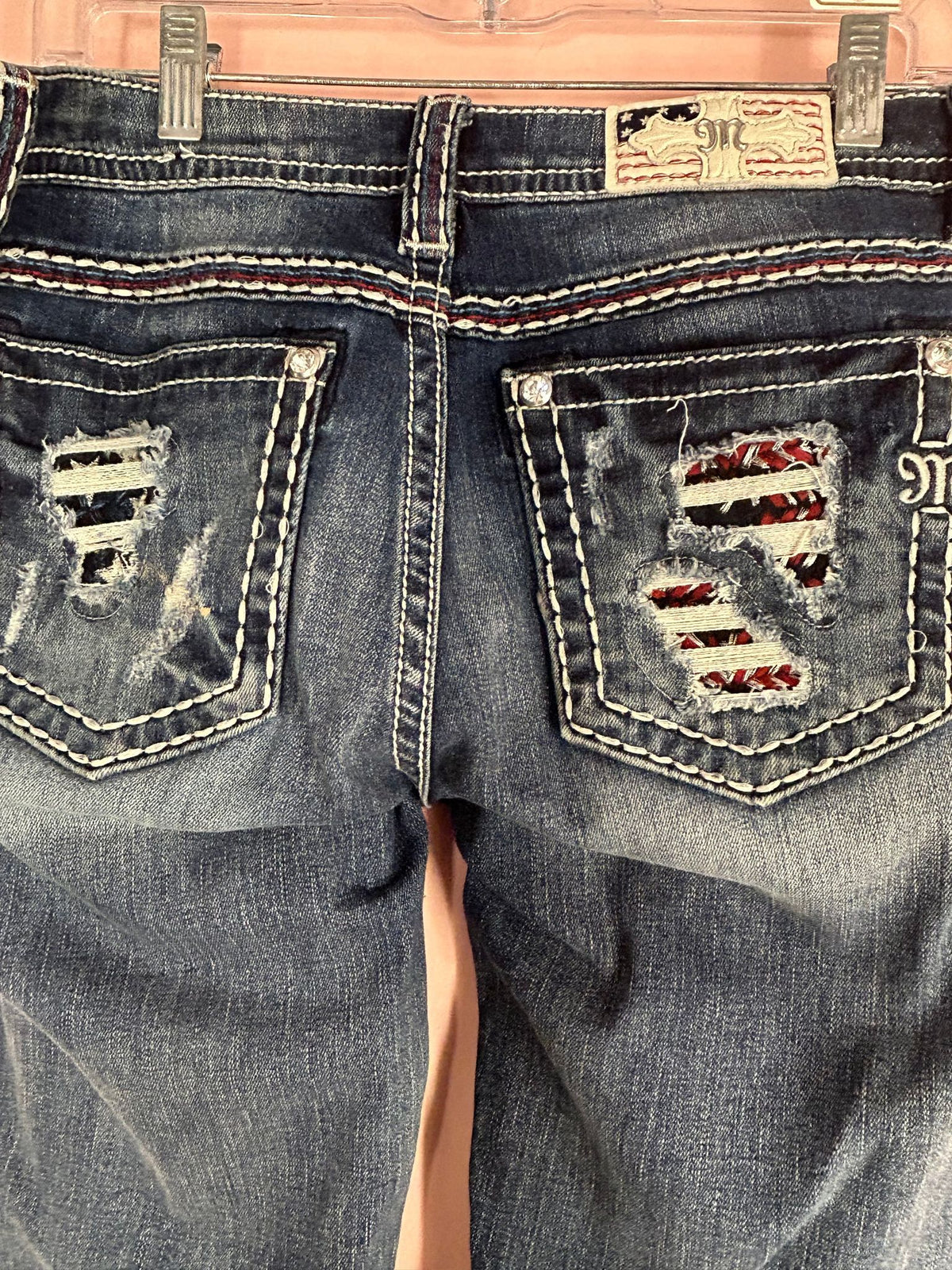 Detail view of distressed Bootcut Jeans for Women, Americana Flag Pockets, Miss Me