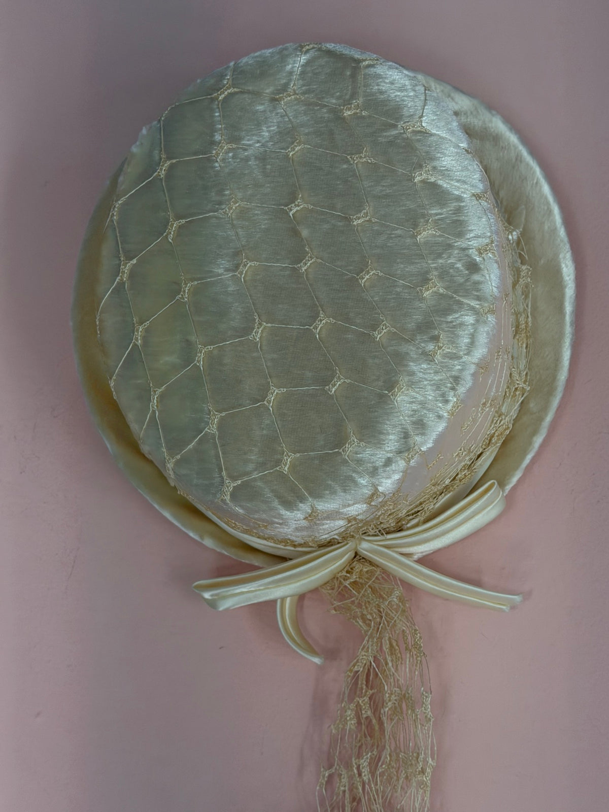 Miss Crosby's vintage ivory hat with net overlay and satin bow, top view