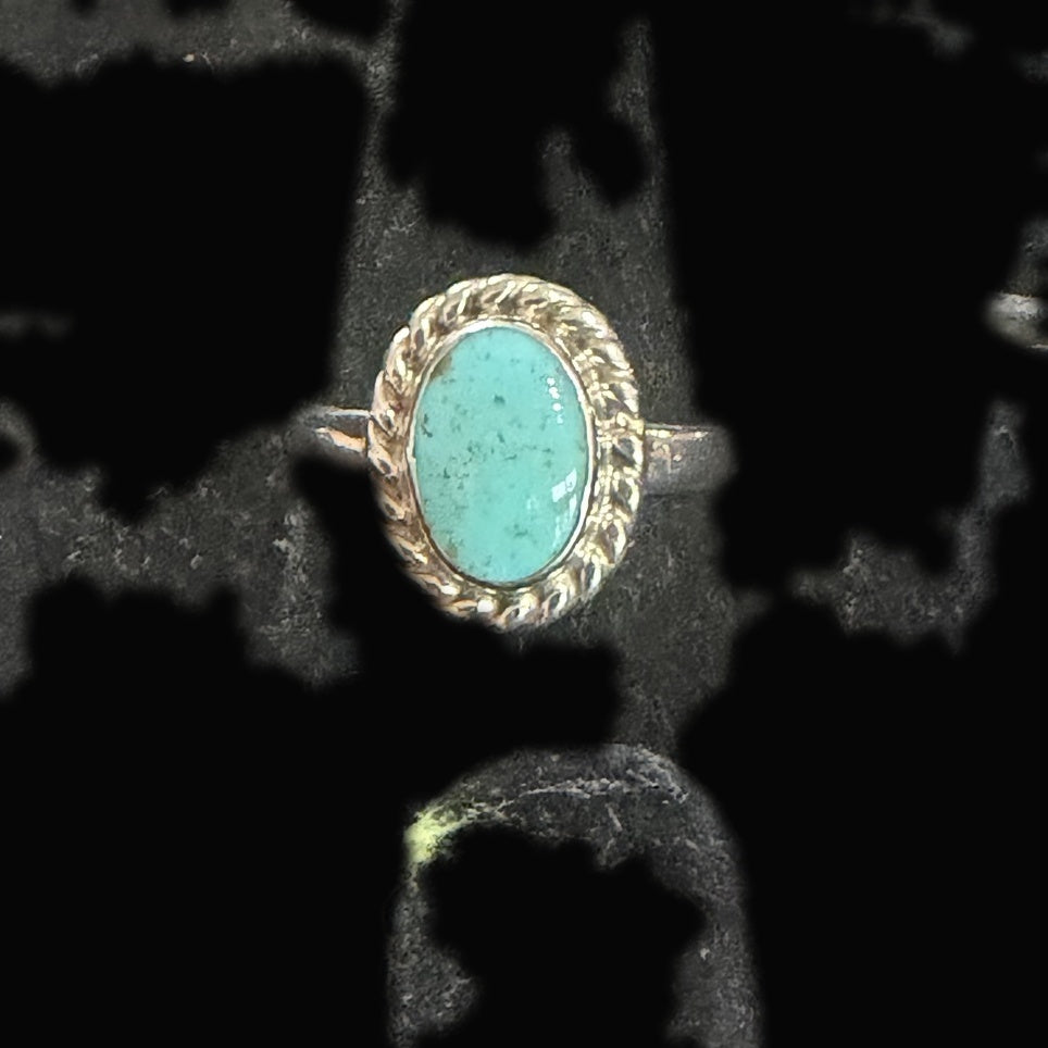 Genuine Turquoise Oval Ring — light teal oval, sea-glass calm with the faintest dark speckles