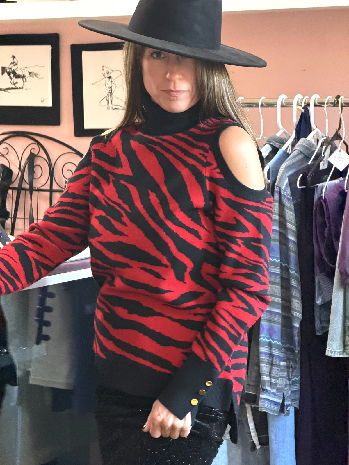 Red and black zebra cold-shoulder sweater worn in store at Regul Design Studio