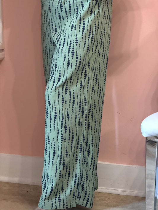 Sage green dash print wide-leg pants, full-length worn view