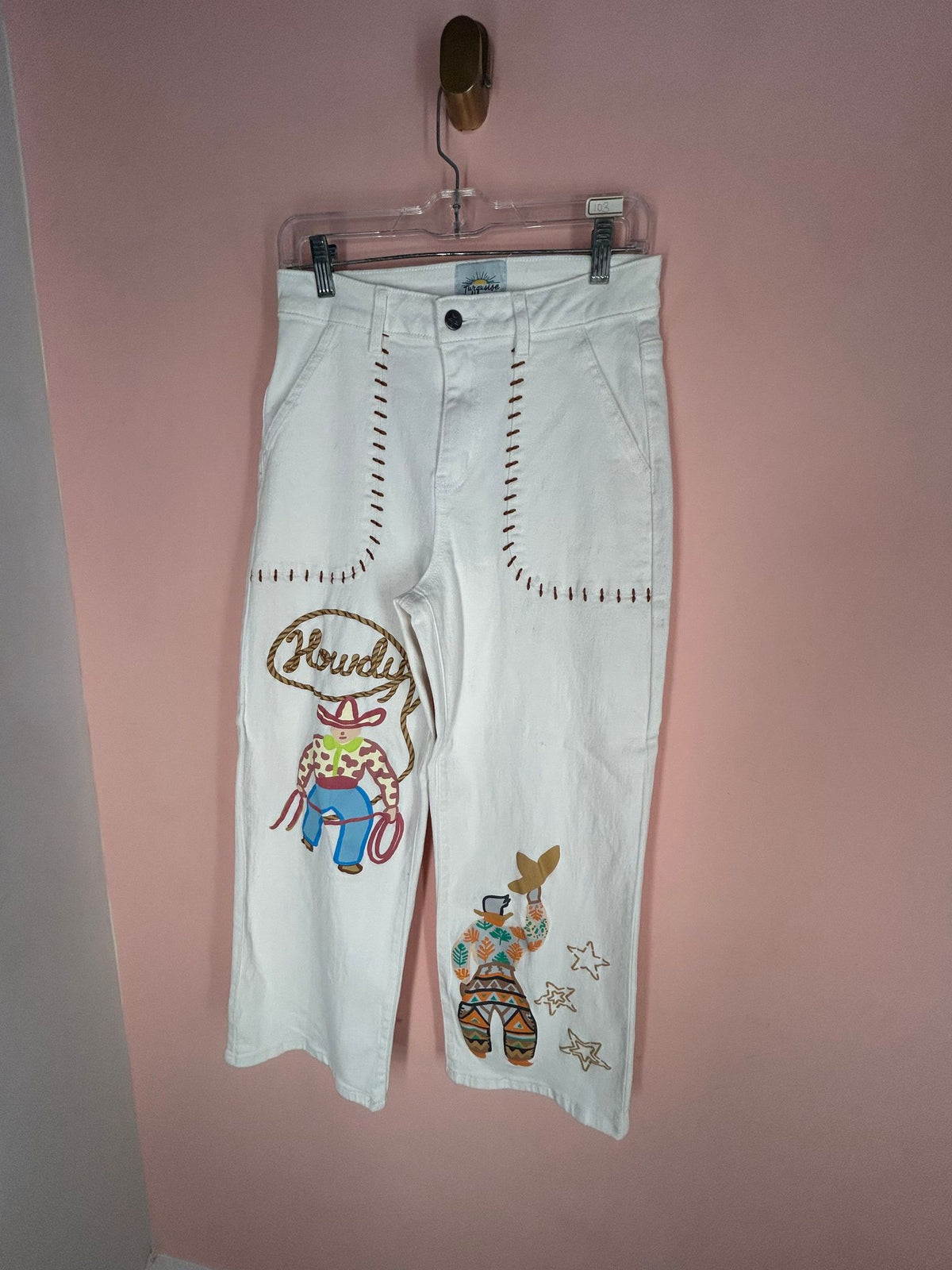 Front view of embroidered Jeans for Women, White 'Howdy' Cowboy, Turquoise