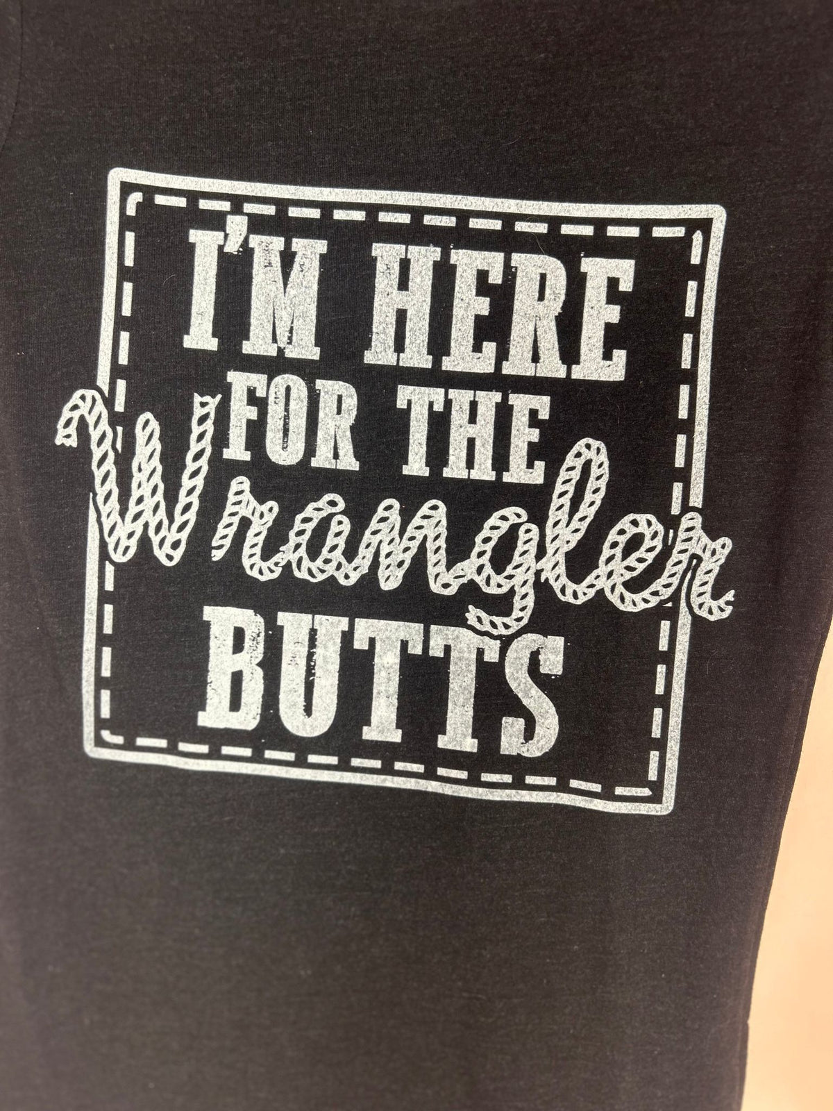 Detail view of black Graphic Tee for Women, 'I'm Here for the Wrangler Butts'