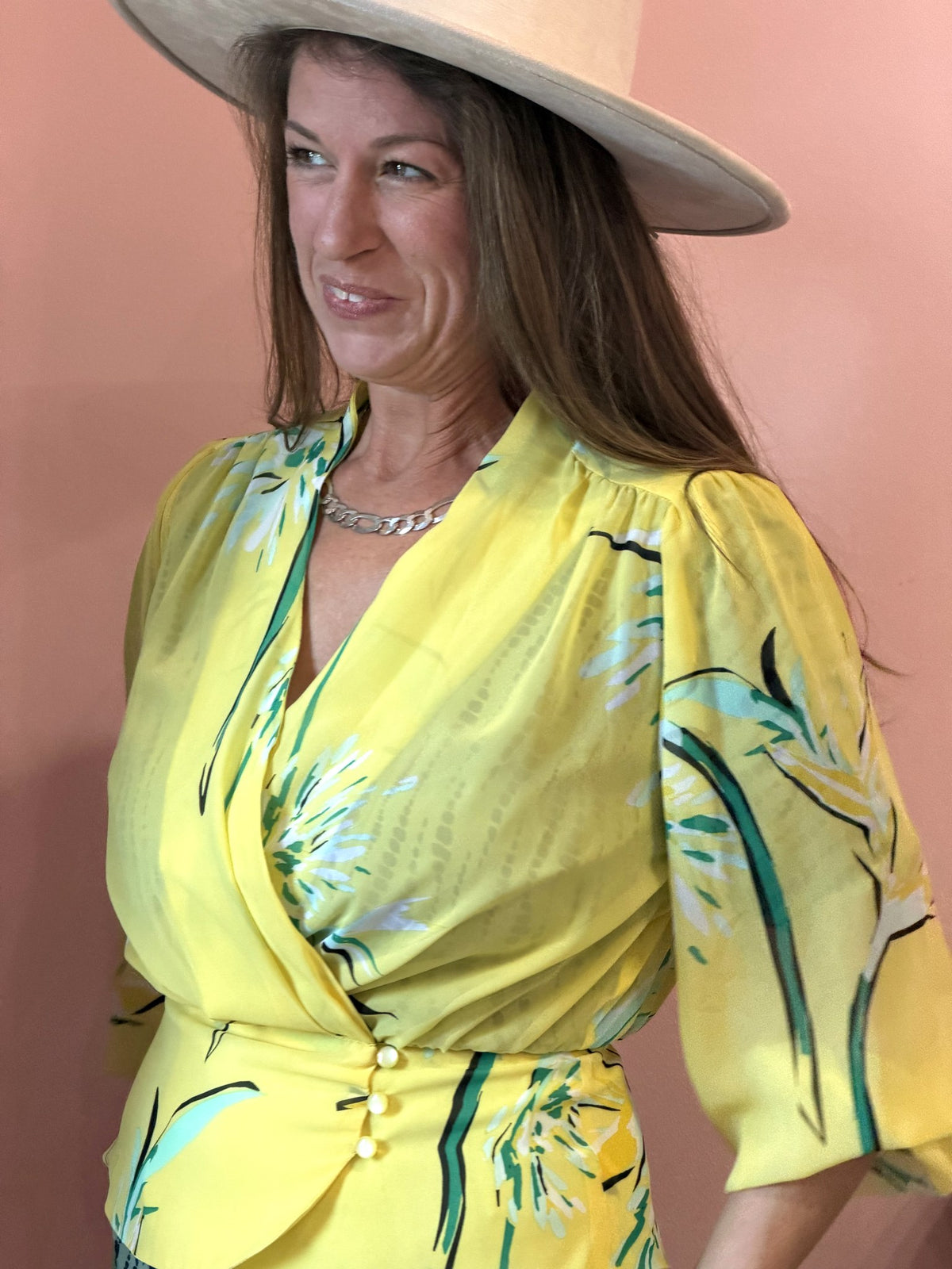 Eva Mendes yellow floral wrap blouse worn, wrap neckline close view