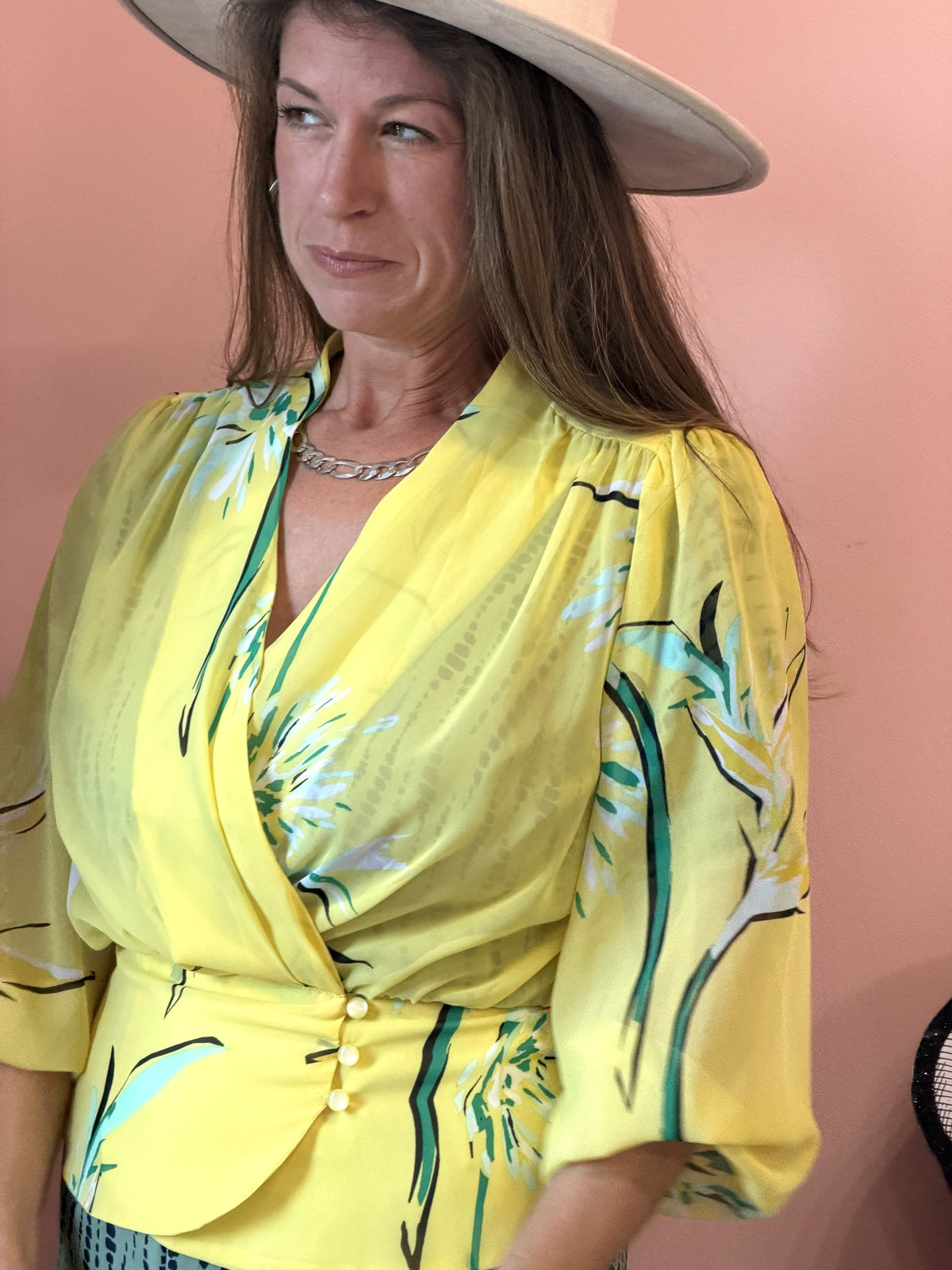 Eva Mendes yellow floral wrap blouse worn, three-quarter view