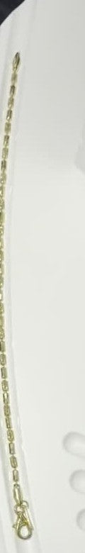 DESMOS barrel link bracelet — long in 18k gold-plated sterling silver, photographed in the DESMOS case at Regul Silver