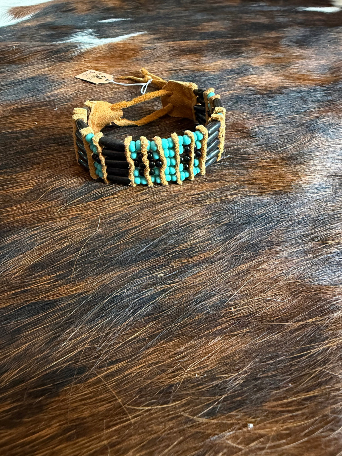 Black hairpipe bracelet with turquoise bead panel by Southwest by Design on cowhide