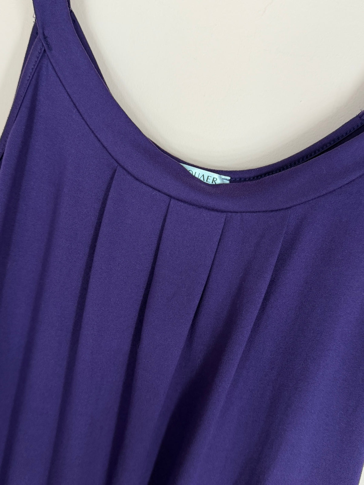 Close-up of the pleated neckline on the purple tunic tank