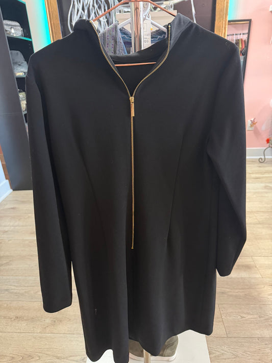 Like new Calvin Klein black long sleeve shift dress with side tie neck detail hanging on a bronze clothing rack.