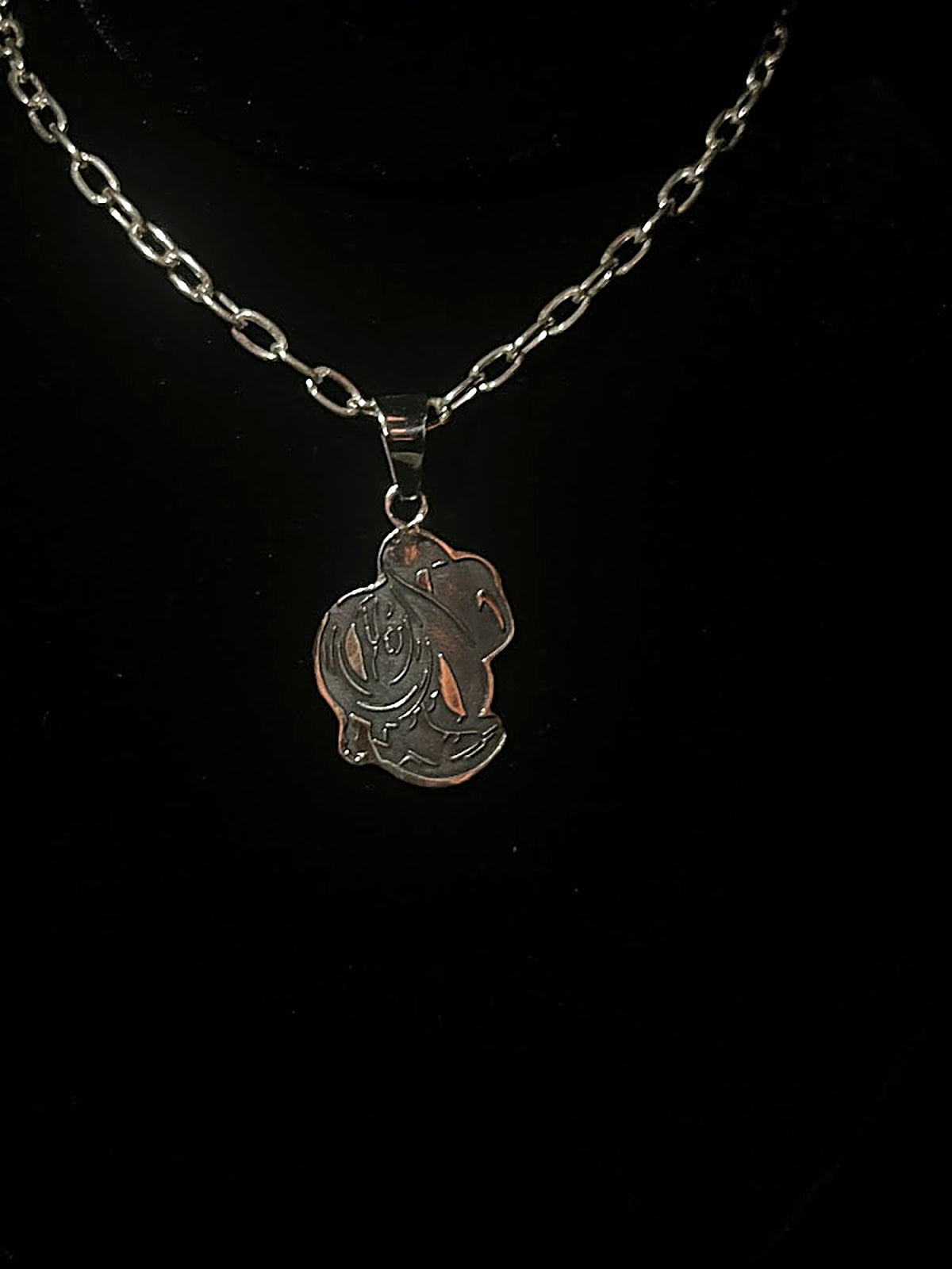 Cowboy hat necklace — front view of the lasered boots, rope and hat pendant in sterling silver on black